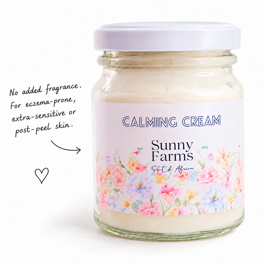 Calming Cream in a white-lidded floral glass jar with handwritten caption